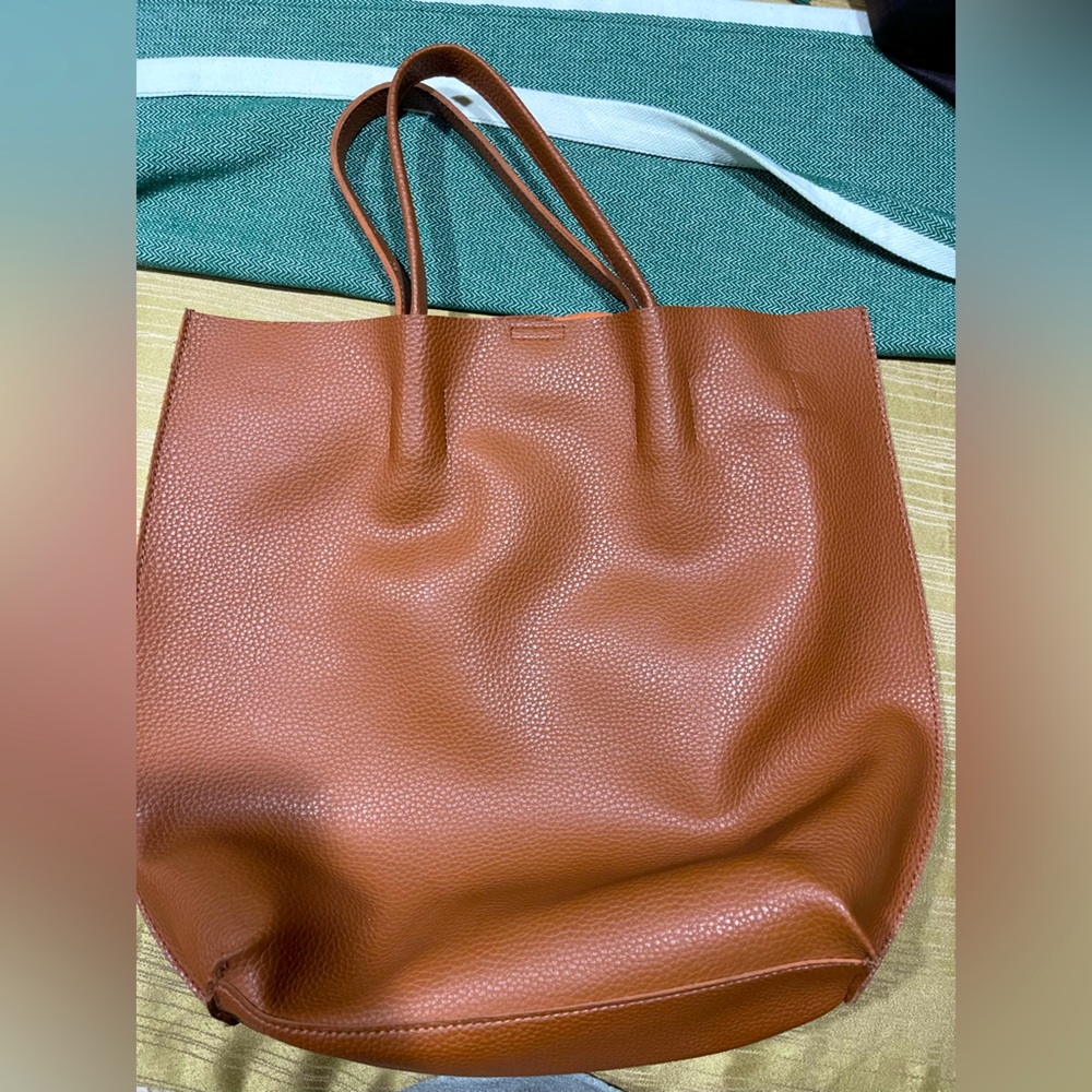 Brown leather shoulder bag with attached wallet